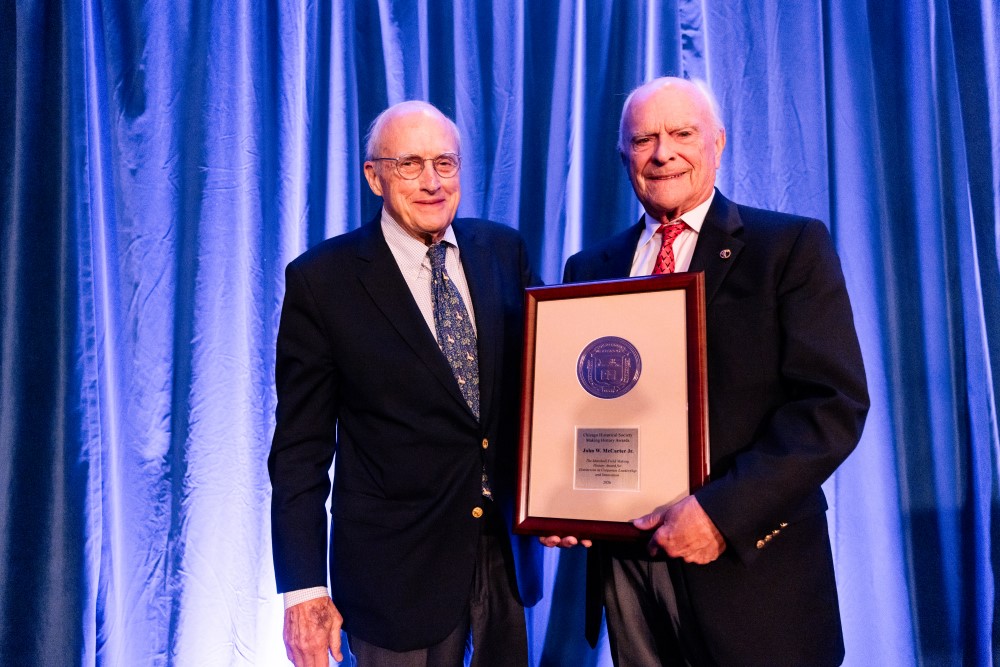 John McCarter, Jr. accepts the Marshall Field Making History Award for Distinction in Corporate Leadership and Innovation from Marshall Field V.